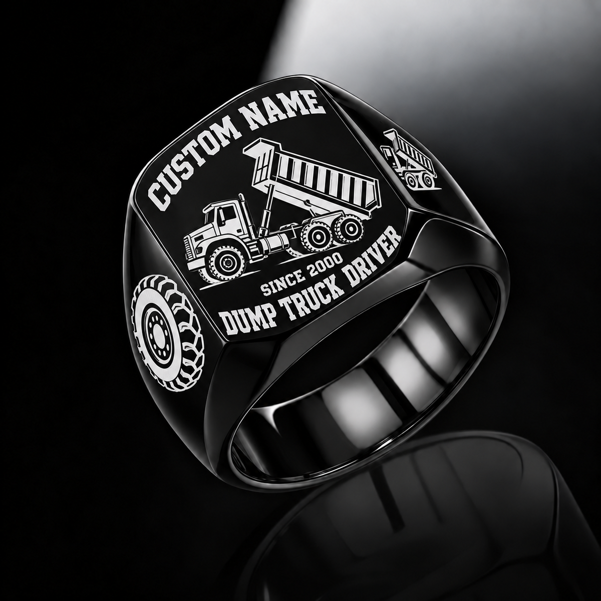 Dump Truck Driver Bold Lettering ring in Black, showing CUSTOM NAME, SINCE 2000, raised-bed dump truck, wheel and matching shoulder emblem