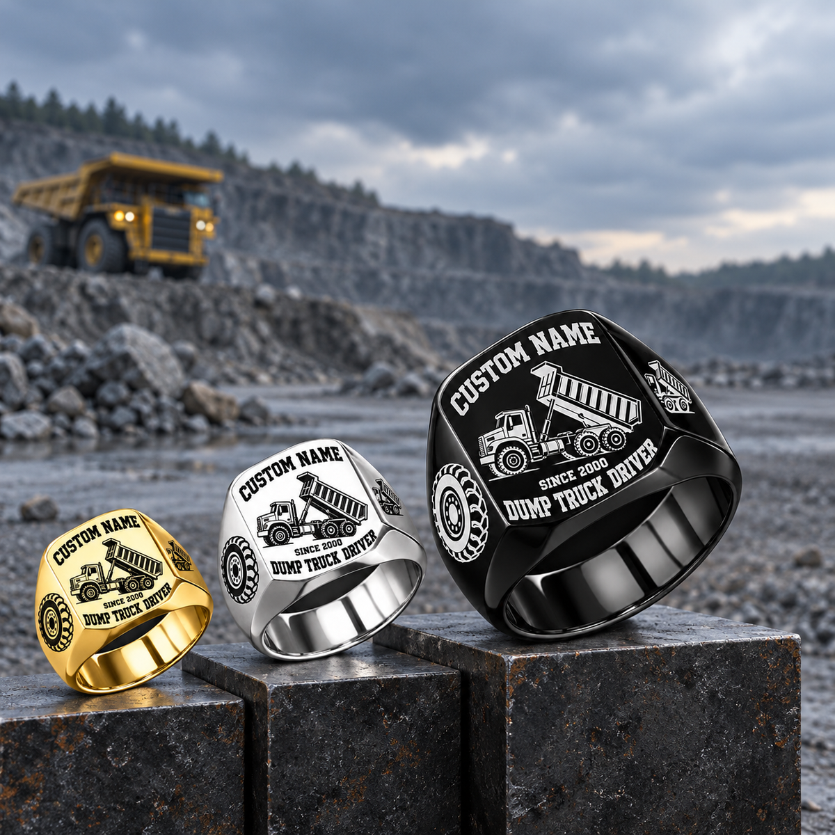 Dump Truck Driver Bold Lettering rings in Gold, Silver and Black on stepped quarry display, with Black largest