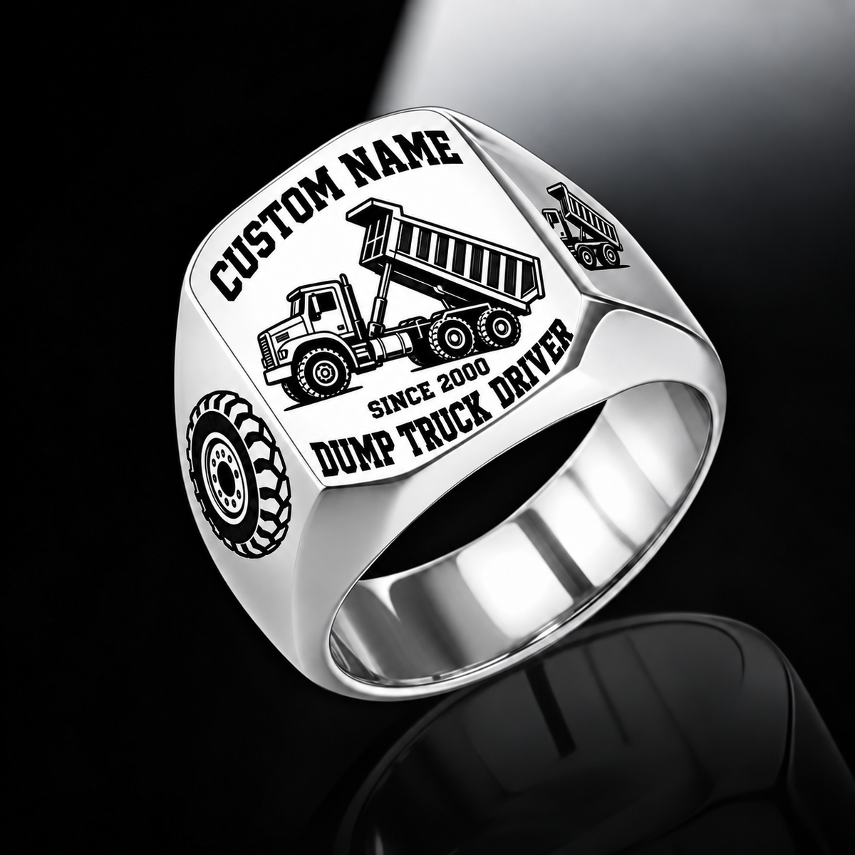 Dump Truck Driver Bold Lettering ring in Silver, showing CUSTOM NAME, SINCE 2000, raised-bed dump truck, wheel and matching shoulder emblem
