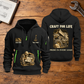 Dump Truck Driver Craft For Life Quarter-Zip Hoodie in Black, full authentic front and back views with matching dump truck driver tools and equipment artwork, original sample name/year and Craft For Life slogan. On a dump truck driver workbench.