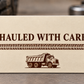 Reverse of the Dump Truck Driver Every Load Aluminum Wallet Card, showing the complete fixed printed artwork and slim aluminum rim.