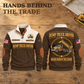 Dump Truck Driver Hands Behind the Trade Sports Sweatshirt in Brown, complete front and back views on a wooden workbench.