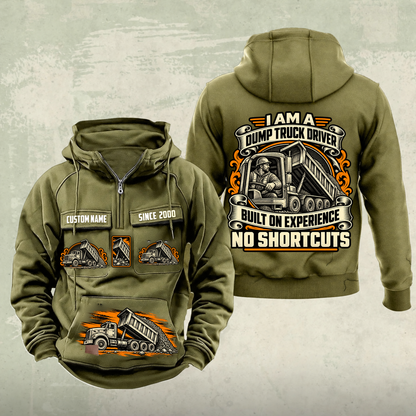 Dump Truck Driver Heritage Crest Vintage Hoodie in Military Green, source-faithful front and back views with an ornate trade portrait crest, matching chest and pouch badges, and illustrative CUSTOM NAME and SINCE 2000 samples.