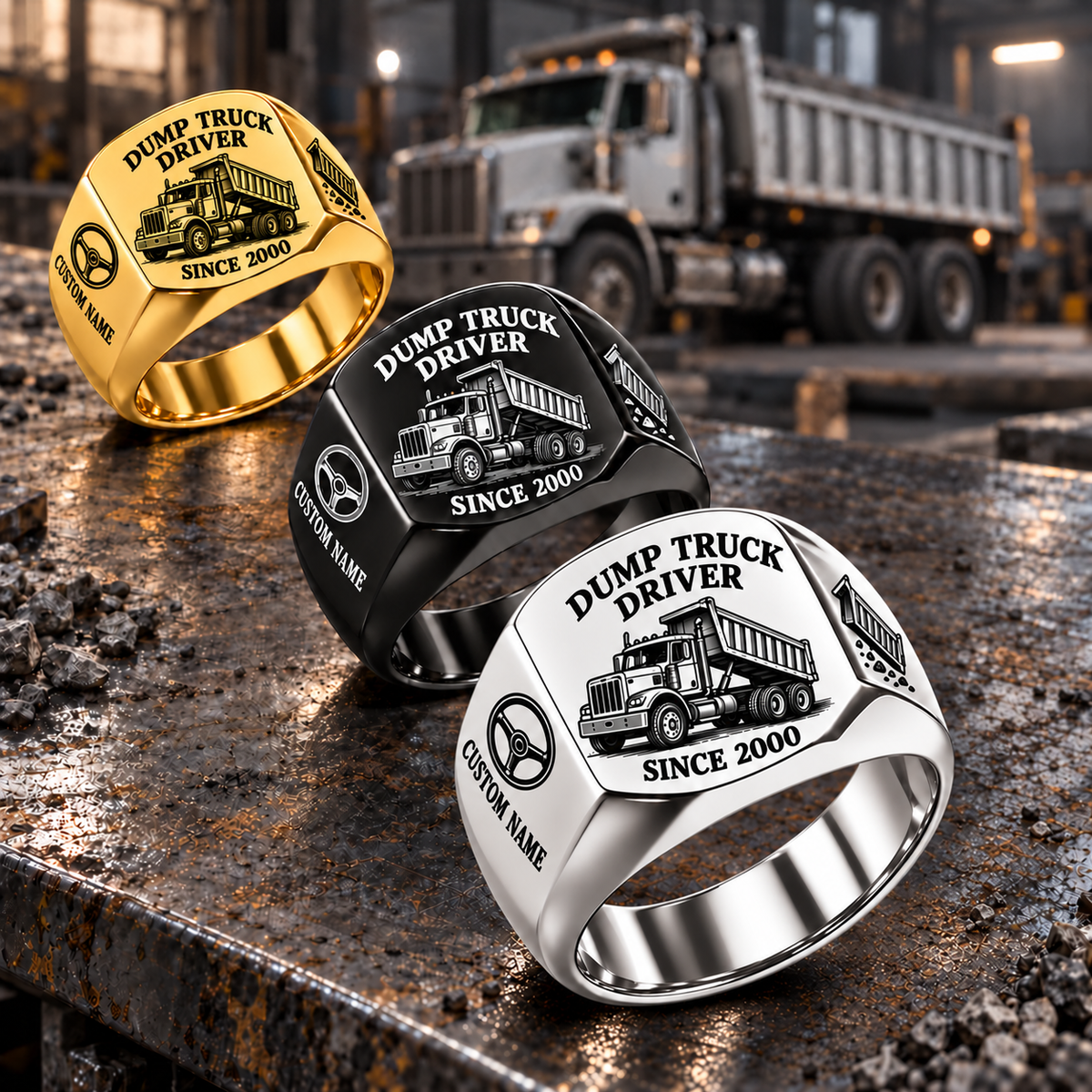 Silver-led diagonal display of Dump Truck Driver Heritage Emblem signet rings in Gold, Black and Silver on a stationary maintenance bench