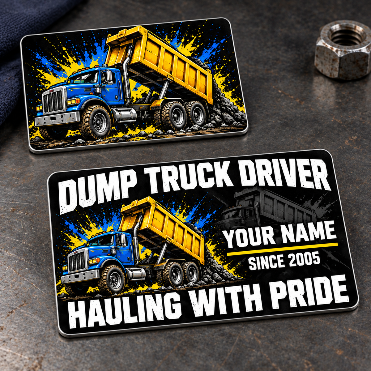 Dump Truck Driver Midnight Splatter Aluminum Wallet Card, showing the complete front and reverse in midnight black, white, blue, yellow with rigid tipping-body dump-truck artwork; two views of one fixed-artwork card.
