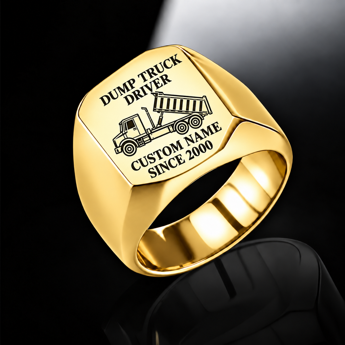 Gold Dump Truck Driver Signature Crest ring with tipping dump-truck engraving, plain shoulders and sample CUSTOM NAME and SINCE 2000 text