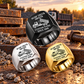 Dump Truck Driver Signature Crest rings in Black, Silver and Gold, in a triangular arrangement on a stationary gravel-yard work surface