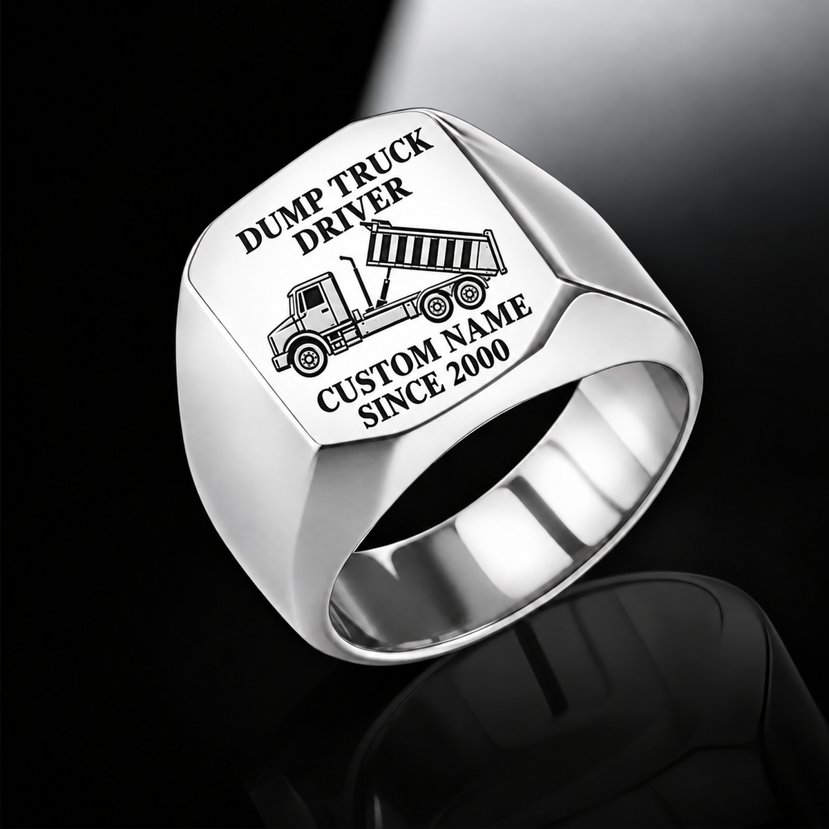 Silver Dump Truck Driver Signature Crest ring with tipping dump-truck engraving, plain shoulders and sample CUSTOM NAME and SINCE 2000 text