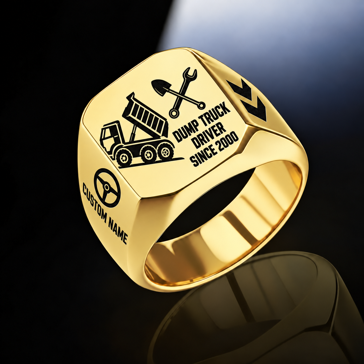 Gold-finish Dump Truck Driver Split Emblem signet ring with raised-bed dump truck, shovel and wrench artwork, and illustrated CUSTOM NAME and SINCE 2000 text