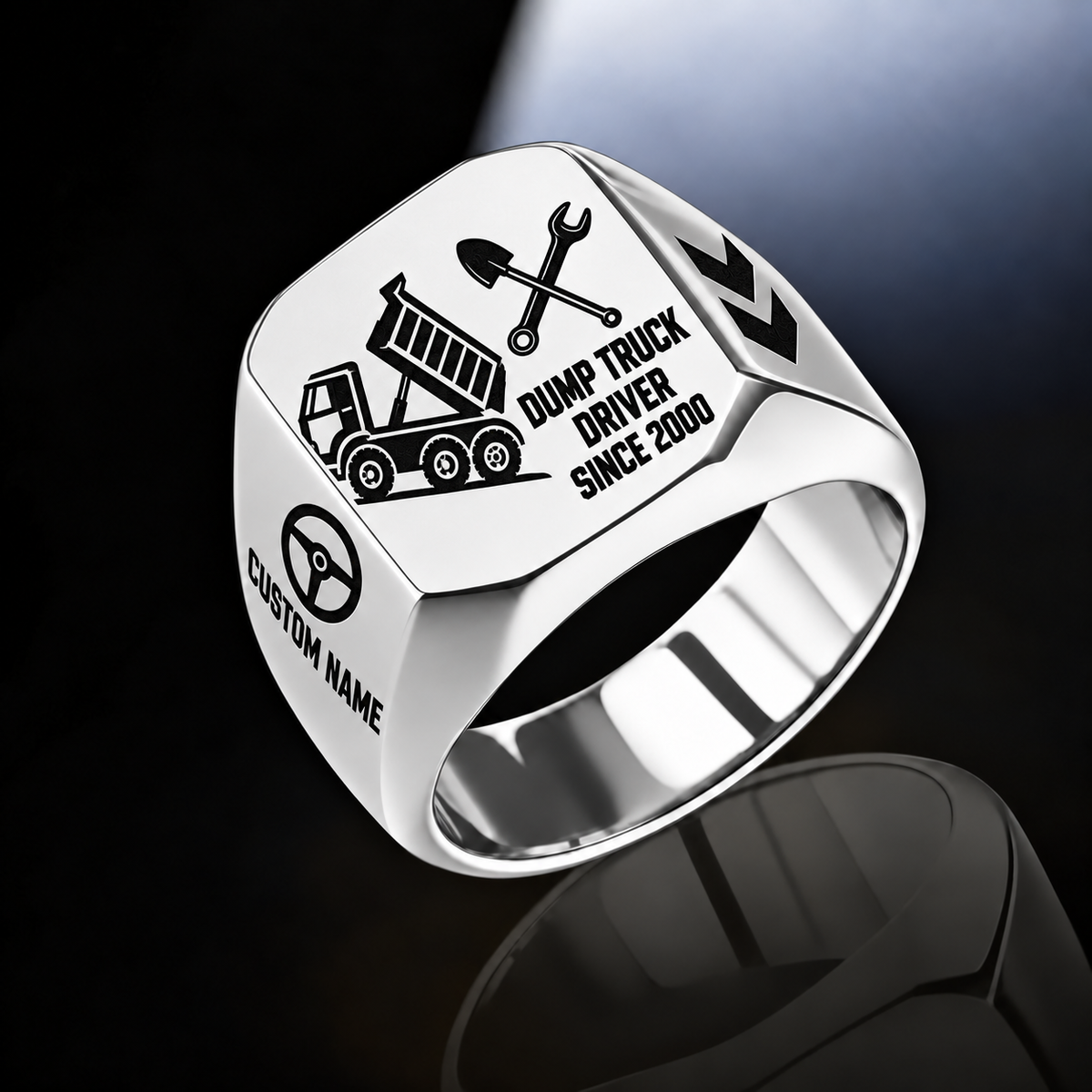 Silver-finish Dump Truck Driver Split Emblem signet ring with raised-bed dump truck, shovel and wrench artwork, and illustrated CUSTOM NAME and SINCE 2000 text