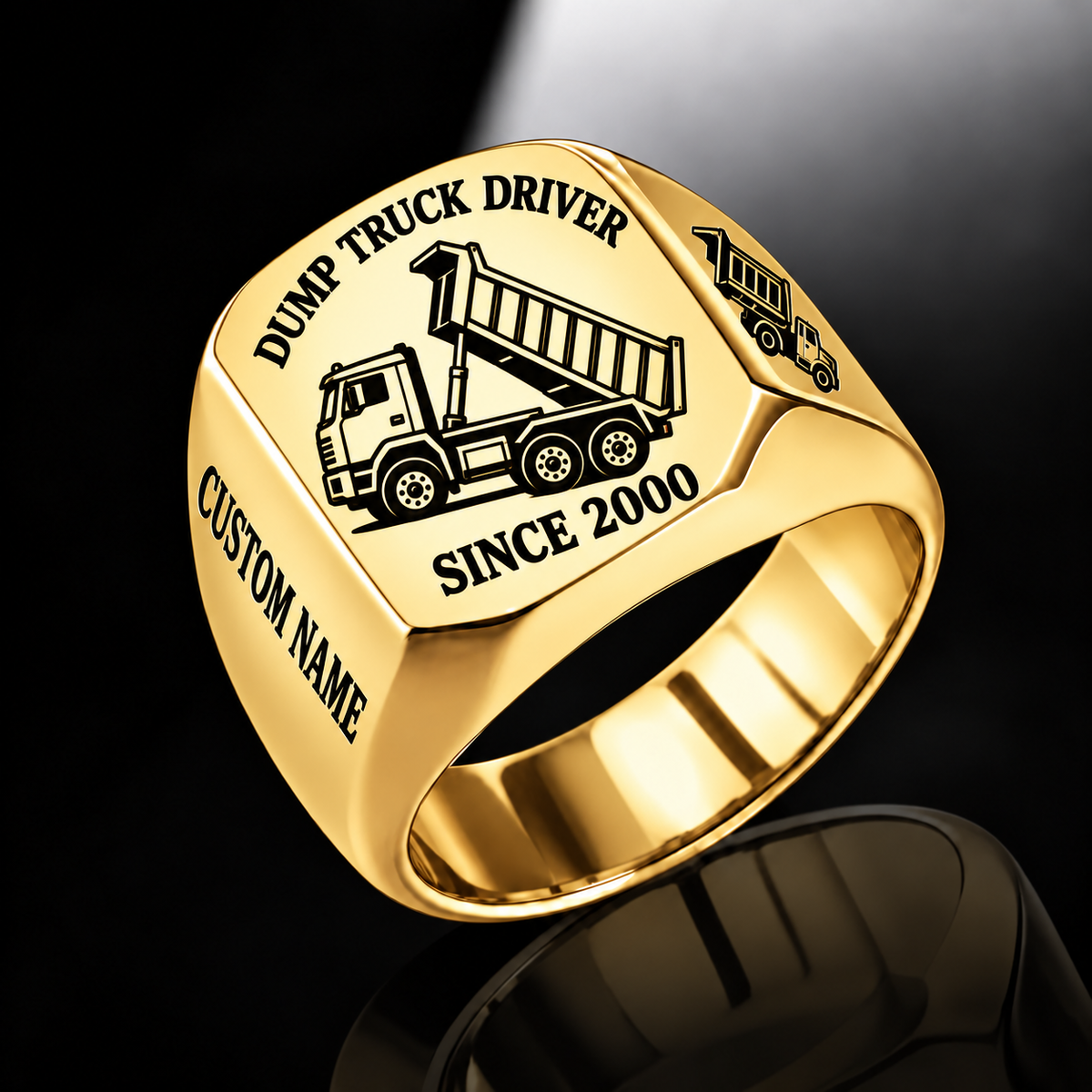 Gold-finish Dump Truck Driver Trade Emblem signet ring with cab, wheels, high-sided tipping cargo bed and matching shoulder truck and illustrated CUSTOM NAME and SINCE 2000 text
