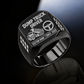 Black-finish Dump Truck Driver Twin Icons signet ring with raised-bed dump truck and steering wheel icons, tire-tread shoulders, and illustrated CUSTOM NAME and SINCE 2000 text