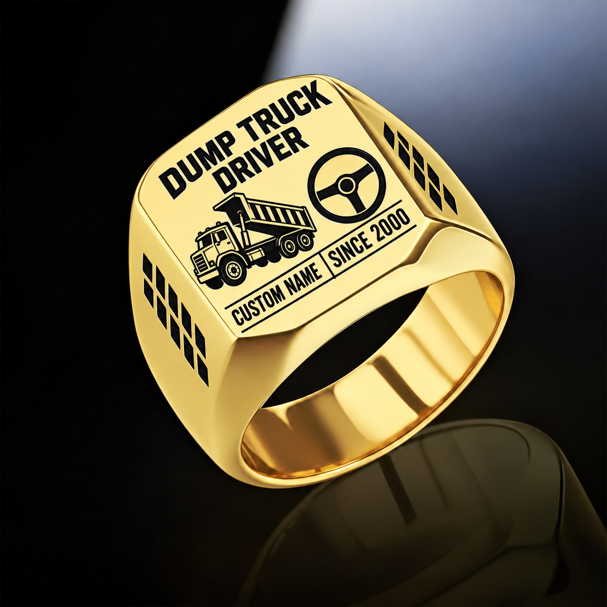 Gold-finish Dump Truck Driver Twin Icons signet ring with raised-bed dump truck and steering wheel icons, tire-tread shoulders, and illustrated CUSTOM NAME and SINCE 2000 text