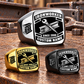 Ironworker Black Face Badge rings in Silver, Gold and Black, with a dominant Silver ring above two smaller finishes on a stationary structural-steel tabletop; sample CUSTOM NAME and SINCE 2000 text