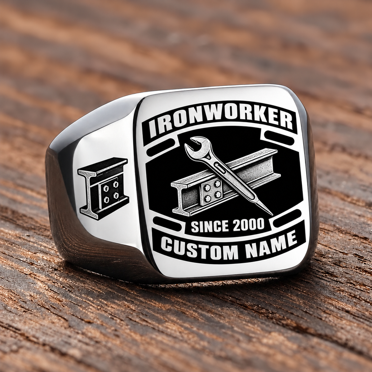Silver-finish Ironworker Black Face Badge ring with bolted structural I-beam and pointed spud wrench artwork, shoulder bolted I-beam emblem and illustrated CUSTOM NAME and SINCE 2000 text