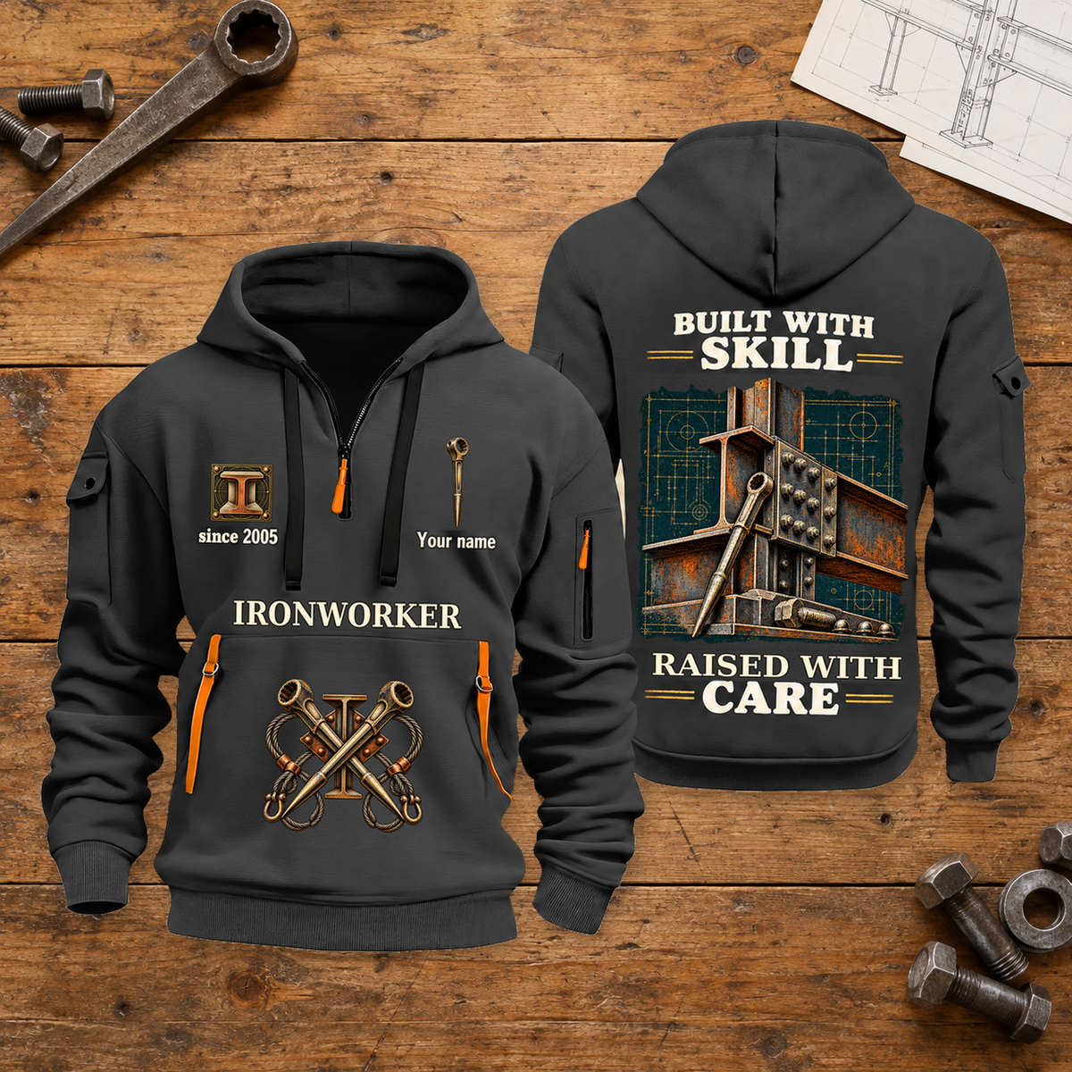Ironworker Built With Skill Quarter-Zip Hoodie in Gray, full authentic front and back views with matching ironworker tools and equipment artwork, original sample name/year and Built With Skill slogan. On a ironworker workbench.