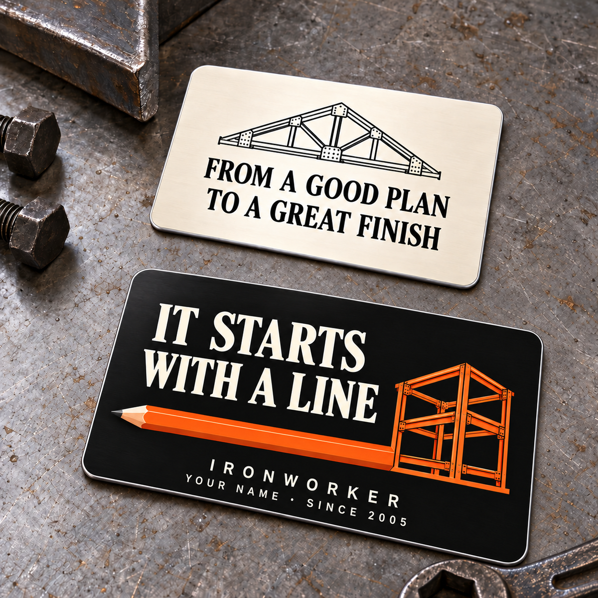 Ironworker First Line aluminum wallet card, showing a black pencil-to-steel-frame front and an ivory steel-truss reverse.