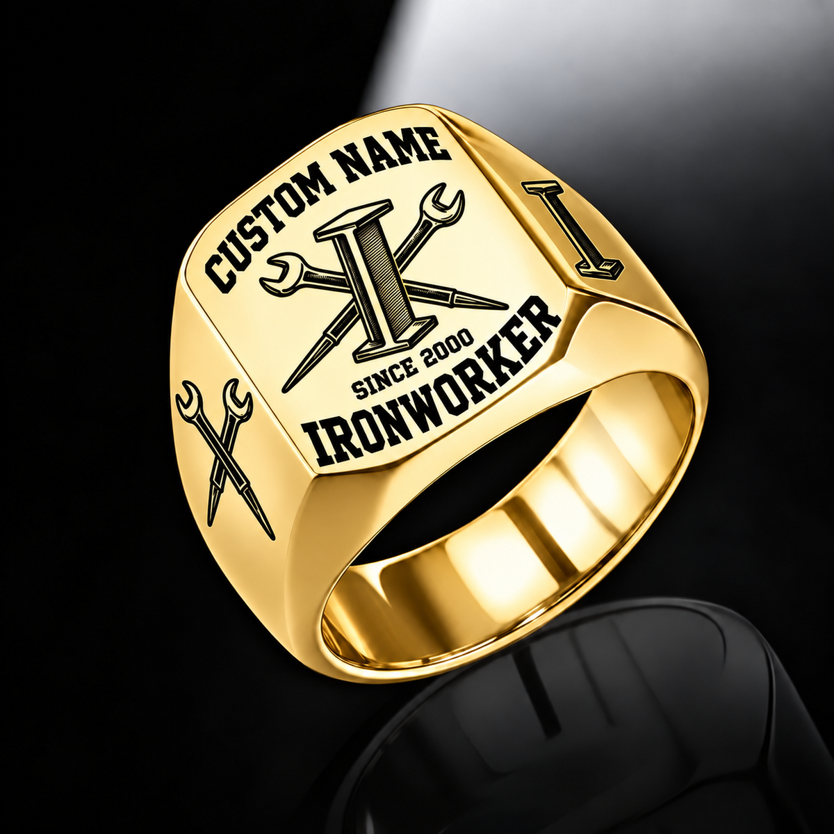 Gold Ironworker Bold Lettering Signet Ring with an I-beam, crossed spud-wrench engraving, matching shoulder motifs, and CUSTOM NAME and SINCE 2000 sample text.
