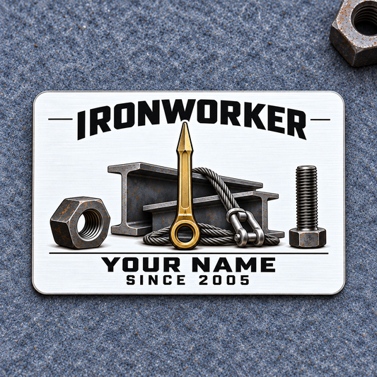 Ironworker Minimal Tool Grid aluminum wallet card front on blue-gray felt, with black lettering, a gold spud wrench, I-beams, structural nut and bolt, and braided lifting sling.