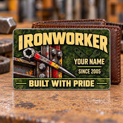 Ironworker Rugged Field Aluminum Wallet Card, complete front with olive camouflage and tan printed artwork and structural steel, spud-wrench and bolted ironwork motifs. Fixed illustrative artwork as shown.