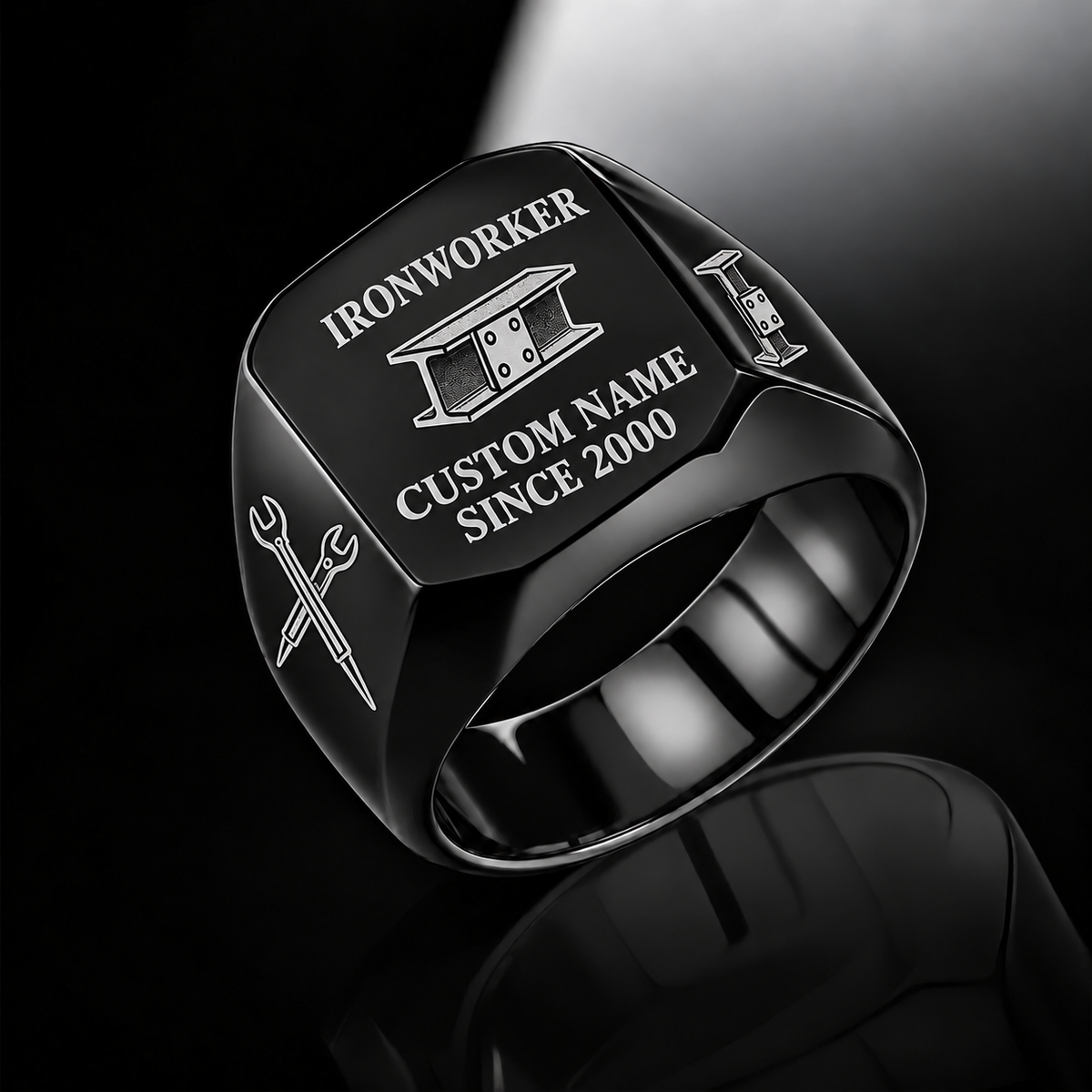 Black-finish Ironworker Signature Crest signet ring with bolted I-beam and pointed spud-wrench engraving, and illustrated CUSTOM NAME and SINCE 2000 text