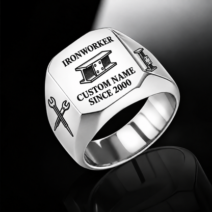 Silver-finish Ironworker Signature Crest signet ring with bolted I-beam and pointed spud-wrench engraving, and illustrated CUSTOM NAME and SINCE 2000 text