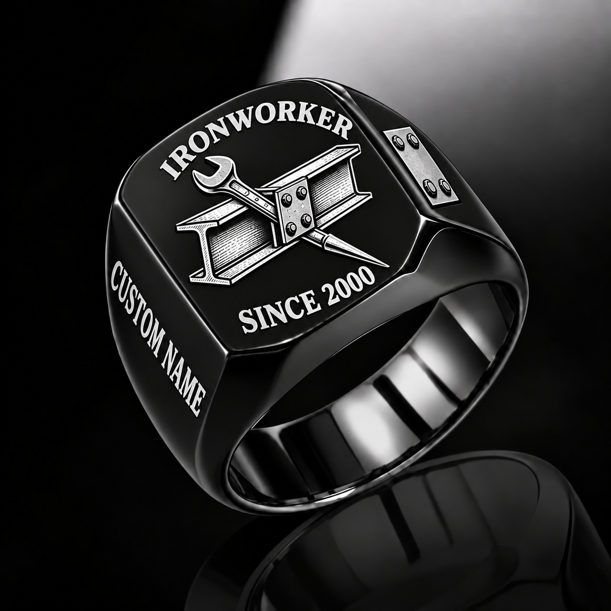 Black-finish Ironworker Trade Emblem signet ring with structural I-beam, bolted plate, pointed spud wrench and illustrated CUSTOM NAME and SINCE 2000 text