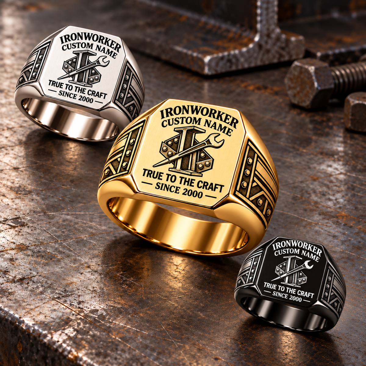 Gold-led diagonal display of Ironworker True to the Craft rings in Silver, Gold and Black at a structural-steel inspection bench