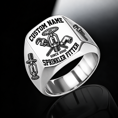 Silver-finish Sprinkler Fitter Bold Lettering signet ring with fire-sprinkler, pipe-wrench and pipe-elbow engraving, and illustrated CUSTOM NAME and SINCE 2000 text