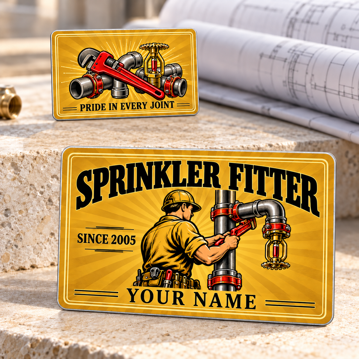 Sprinkler Fitter Golden Milestone Aluminum Wallet Card, showing the complete front and reverse with golden sunburst, cream double borders, black vintage lettering, a sprinkler fitter at a fire-protection riser, and a pipe wrench with steel fittings and brass fire-sprinkler head; two views of one fixed-artwork card.