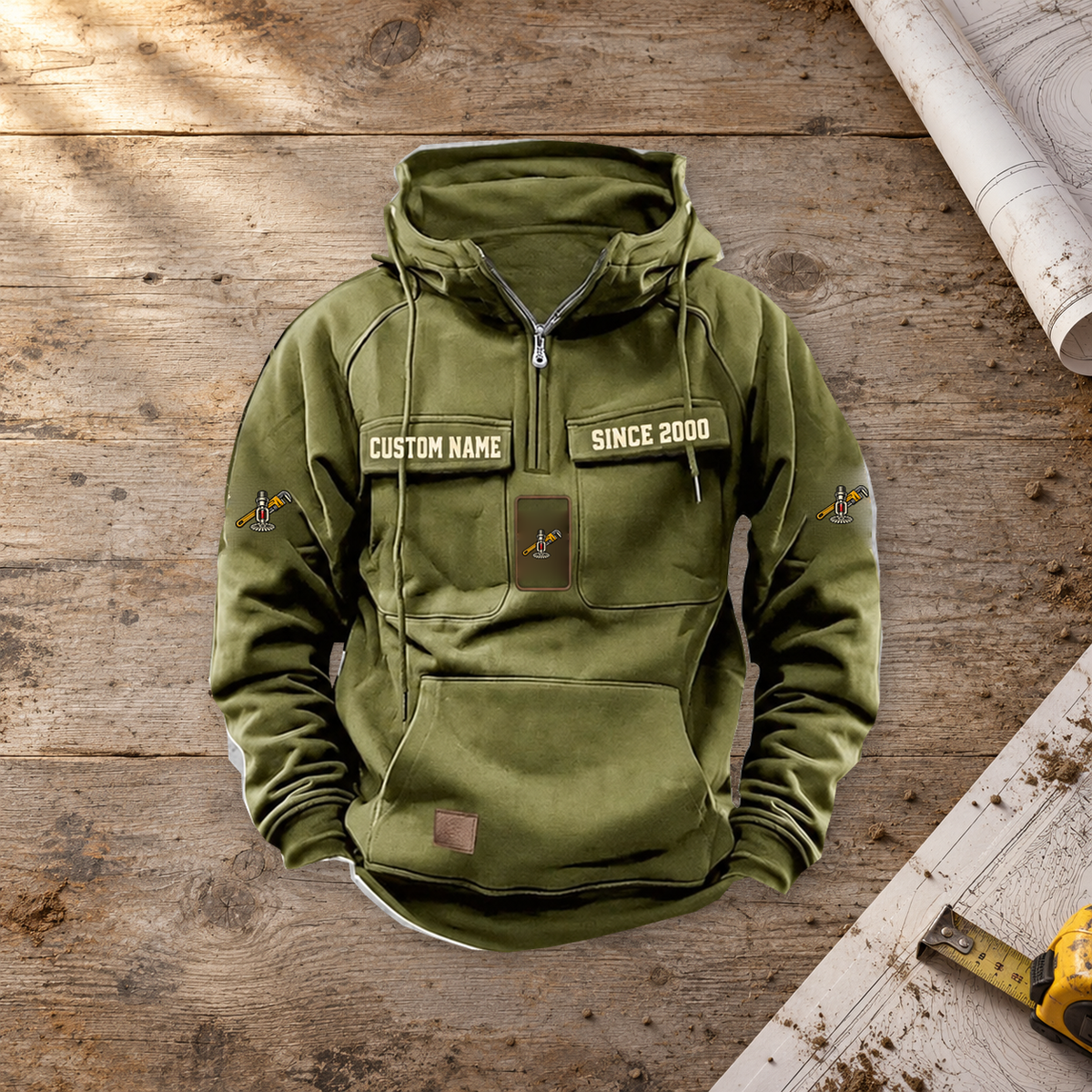 Sprinkler Fitter Once and Always Vintage Hoodie in Military Green, single front view on a warm construction planning workbench.