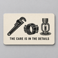 Cream reverse of the Sprinkler Fitter aluminum wallet card with a black pipe wrench, coupling and fire-sprinkler head above The Care Is in the Details.
