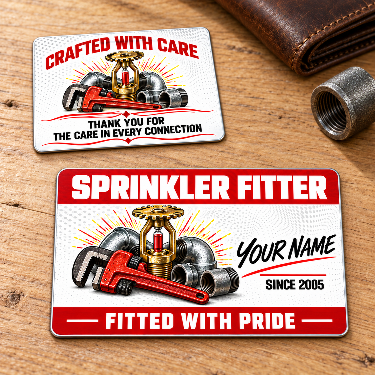 Sprinkler Fitter Red Header Aluminum Wallet Card, complete front and reverse; the reverse shows Crafted with Care, matching pipe-wrench and fire-sprinkler artwork, and Thank You for the Care in Every Connection. Two views of one card, not separate variants.