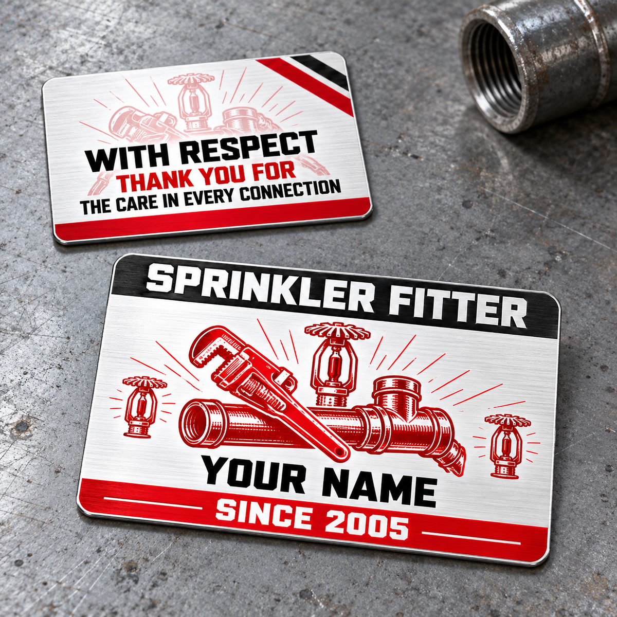Sprinkler Fitter Red Monochrome Aluminum Wallet Card, showing the complete front and reverse with red monochrome pipe wrench, pipe fittings and fire-sprinkler illustrations with black-and-white header, red footer and pale-pink reverse artwork; two views of one fixed-artwork card.