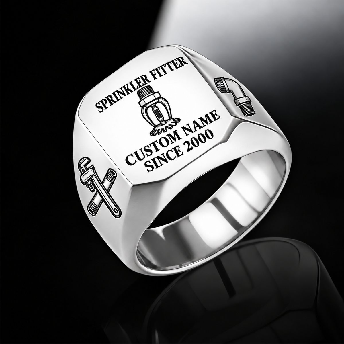 Silver-finish Sprinkler Fitter Signature Crest signet ring with pendent fire-sprinkler head, pipe wrench and threaded-pipe shoulder engraving, and illustrated CUSTOM NAME and SINCE 2000 text