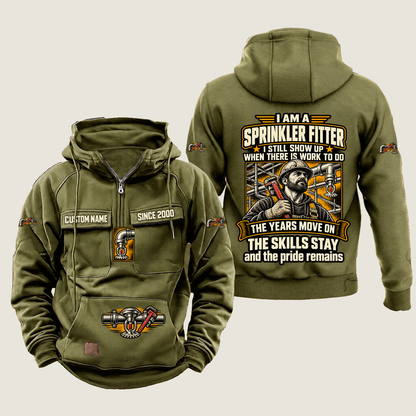 Sprinkler Fitter Skills and Pride Vintage Hoodie in Military Green, source-faithful front and back views with a trade portrait, experience-themed lettering and coordinated sleeve, chest and pouch emblems, and illustrative CUSTOM NAME and SINCE 2000 samples.