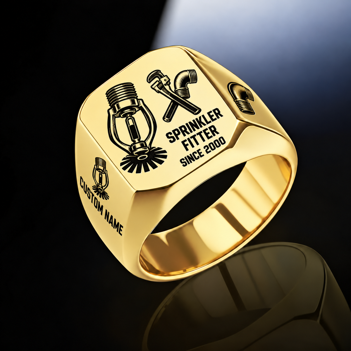 Sprinkler Fitter Split Emblem ring in Gold, showing fire-sprinkler head and pipe-tool artwork with CUSTOM NAME and SINCE 2000 sample engraving.