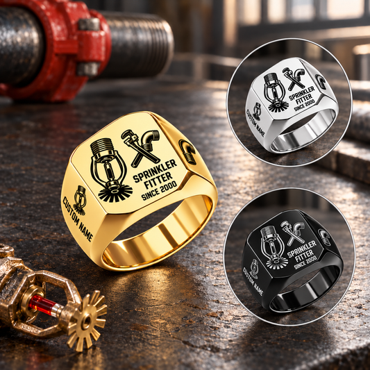 Sprinkler Fitter Split Emblem ring in Gold with separate Silver and Black inset views on a sprinkler-fitting workbench; sample CUSTOM NAME and SINCE 2000 engraving.