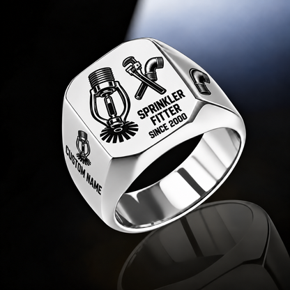 Sprinkler Fitter Split Emblem ring in Silver, showing fire-sprinkler head and pipe-tool artwork with CUSTOM NAME and SINCE 2000 sample engraving.