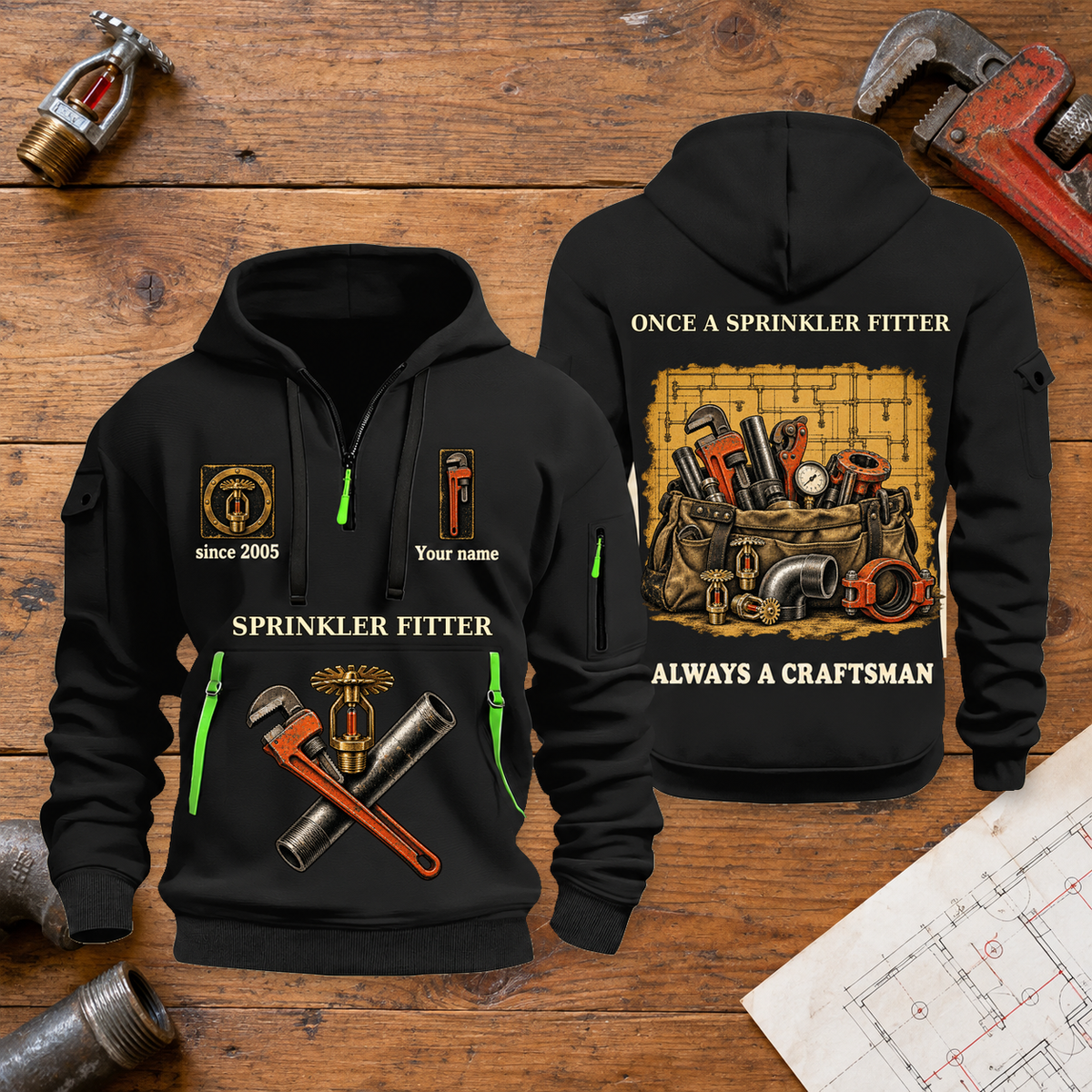 Sprinkler Fitter Trade For Life Quarter-Zip Hoodie in Black, full authentic front and back views with matching sprinkler fitter tools and equipment artwork, original sample name/year, niche-specific ONCE A headline and original ALWAYS A CRAFTSMAN footer. On a sprinkler fitter workbench.