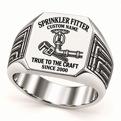 Silver Sprinkler Fitter True to the Craft ring with connected fire-sprinkler, pipe and wrench artwork and pipe-work shoulder engraving