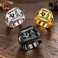 Sprinkler Fitter Twin Icons signet rings in a Black-led triangular arrangement with Silver and Gold on a stationary fire-sprinkler fitting workbench
