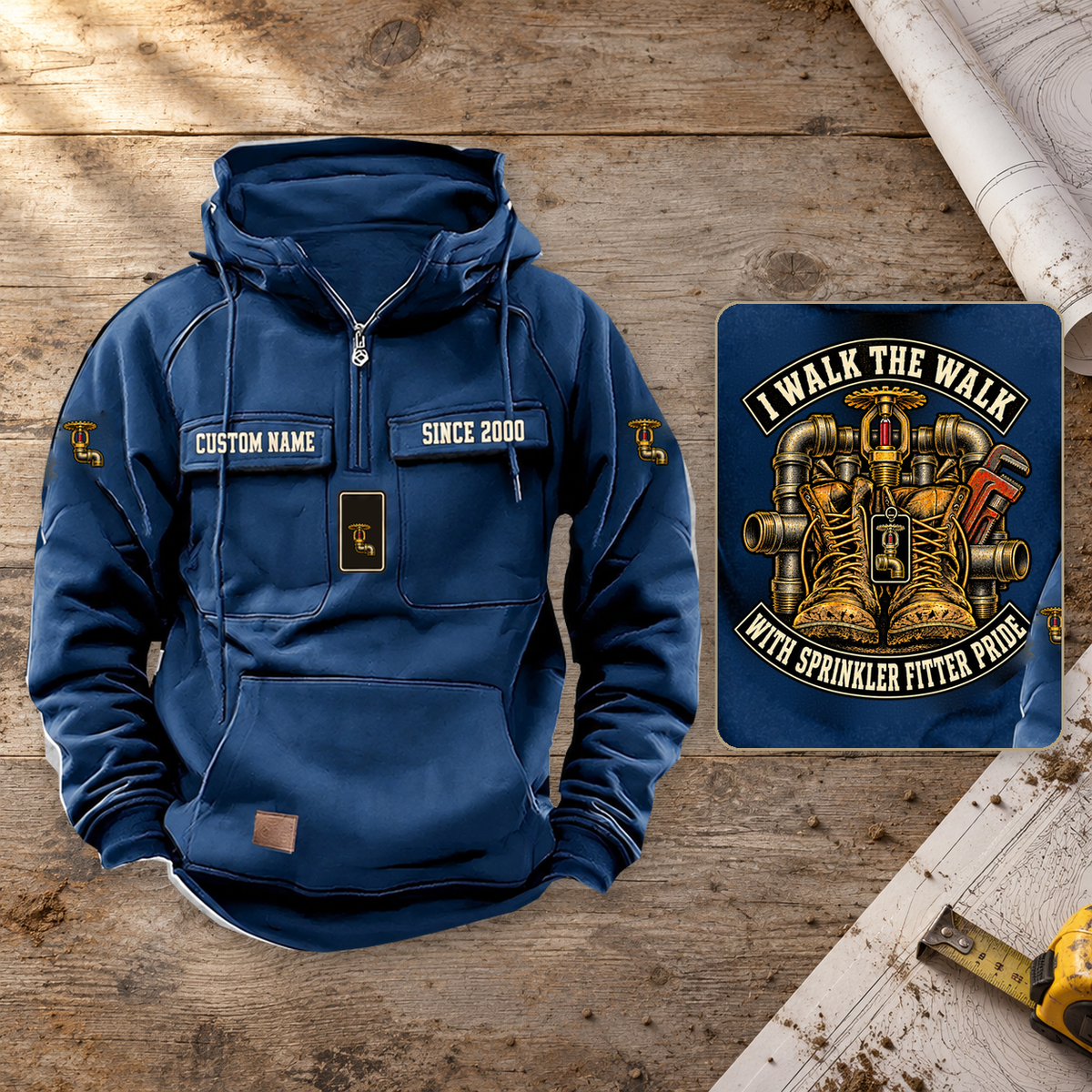 Sprinkler Fitter Walk the Walk Badge Vintage Hoodie in Dark Blue on a warm planning workbench, dominant front with complete back-art detail inset.