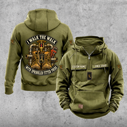 Sprinkler Fitter Walk the Walk Badge Vintage Hoodie in Military Green, front and back, with work boots and a fire sprinkler head, steel pipe fittings and a pipe wrench, matching sleeve and chest emblems, and illustrative CUSTOM NAME and SINCE 2000 text.