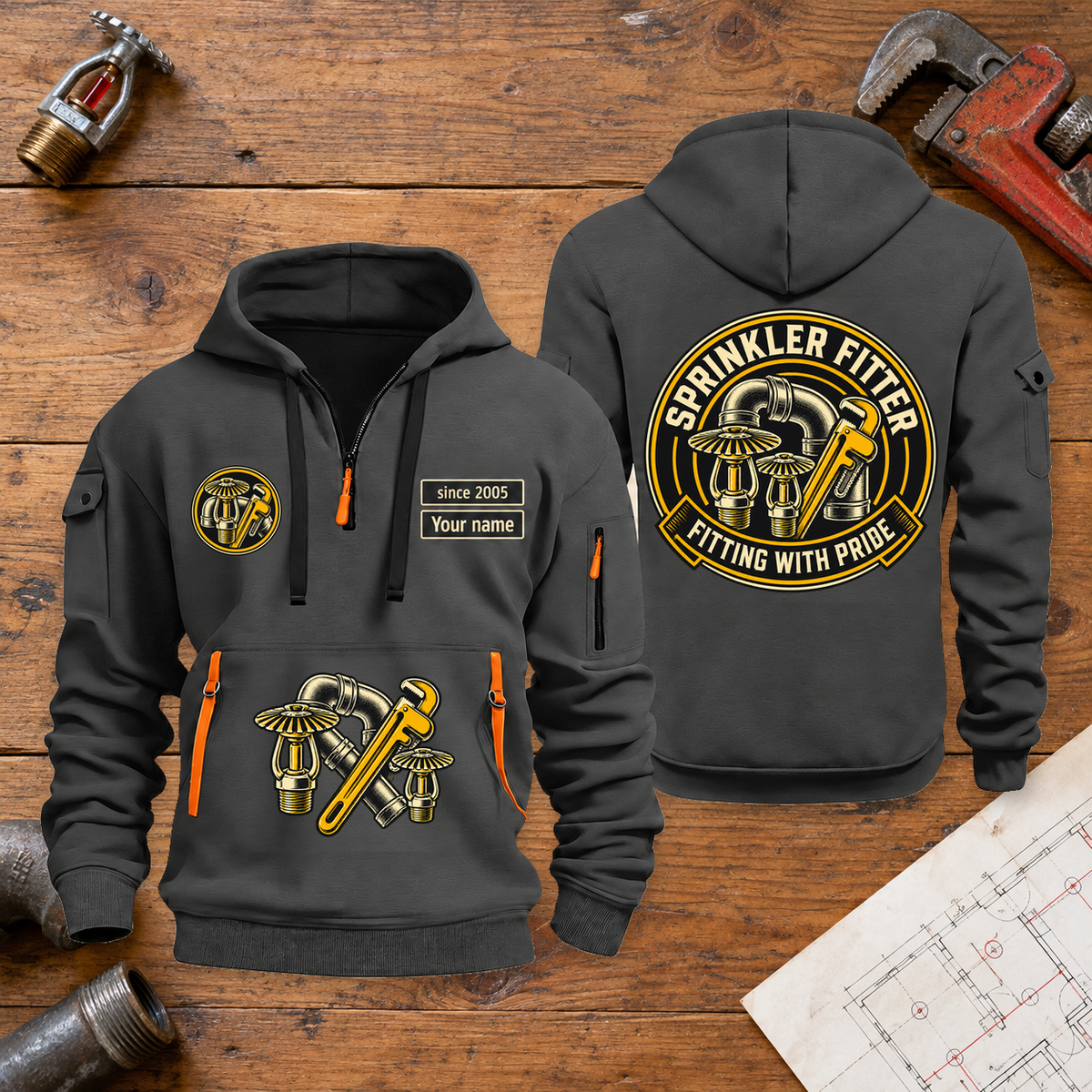 Sprinkler Fitter Fitting With Pride Quarter-Zip Hoodie in Gray, full authentic front and back views with matching sprinkler fitter tools and equipment artwork, original sample name/year and trade-pride badge lettering. On a sprinkler fitter workbench.