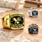 Wallpaper Hanger Black Face Badge rings: dominant Gold with separate smaller Silver and Black circular insets on a stationary wallpaper pasting table
