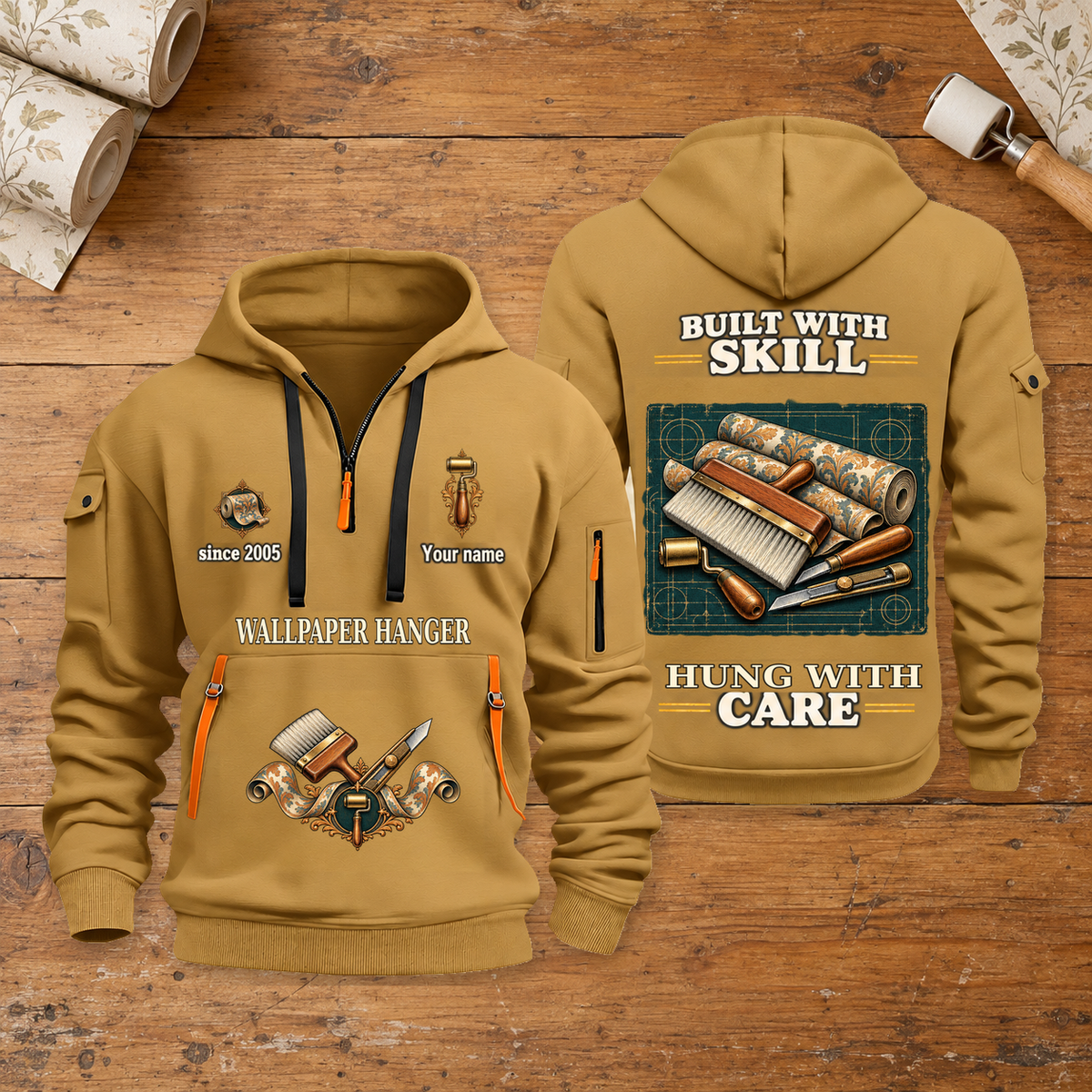 Wallpaper Hanger Built With Skill Quarter-Zip Hoodie in Khaki, full authentic front and back views with matching wallpaper hanger tools and equipment artwork, original sample name/year and Built With Skill slogan. On a wallpaper hanger workbench.