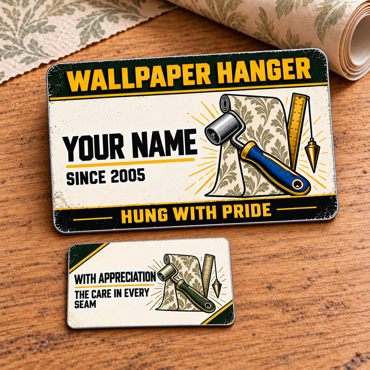 Front and reverse views of the Wallpaper Hanger Heritage Band aluminum wallet card on a warm wooden table, with patterned wallpaper and seam-roller artwork.