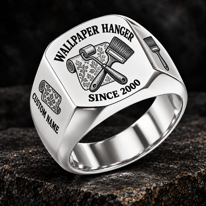 Silver-finish Wallpaper Hanger Heritage Emblem signet ring with patterned wallpaper-roll, seam-roller and pasting-brush engraving, and illustrated CUSTOM NAME and SINCE 2000 text