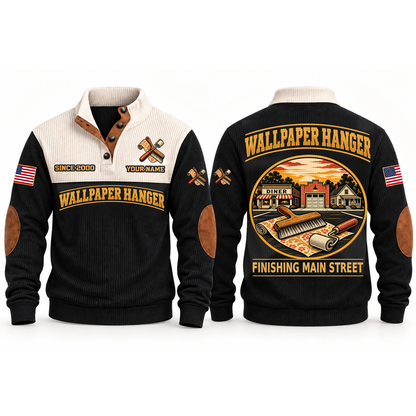 Wallpaper Hanger Main Street Finish Sports Sweatshirt in Black, front and back garment views with wallpaper roll, smoothing brush and seam roller, nostalgic Main Street town illustration, FINISHING MAIN STREET lettering and source sample YOUR NAME and SINCE 2000 text.